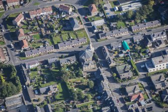 Oblique aerial view of St Margaret's School, St Margaret's Roman Catholic Church and Presbytery, looking NE.