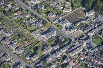 Oblique aerial view of Strathbogie Manse, TA Centre and Police Station, looking N.