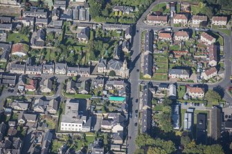 Oblique aerial view of St Margaret's School, St Margaret's Roman Catholic Church and Presbytery, looking WNW.