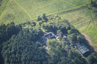 Oblique aerial view of Rothiemay House and Castle, looking S.