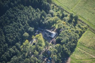 Oblique aerial view of Rothiemay House and Castle, looking SE.