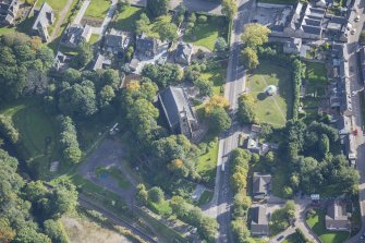 Oblique aerial view of St Rufus Church, looking E.