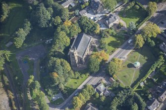 Oblique aerial view of St Rufus Church, looking NE.