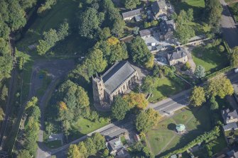 Oblique aerial view of St Rufus Church, looking N.