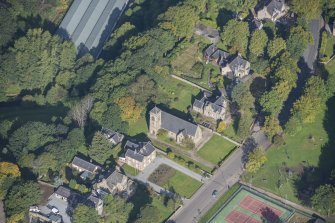 Oblique aerial view of St Rufus Church, looking WNW.