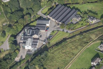 Oblique aerial view of Strathmill Distillery, looking NW.