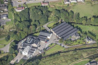 Oblique aerial view of Strathmill Distillery, looking WNW.