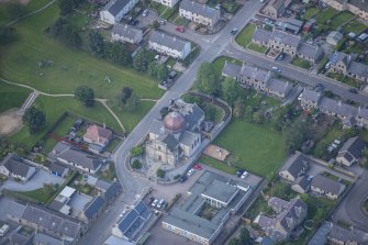Oblique aerial view of St Thomas' Roman Catholic Church and Presbytery, looking SW.