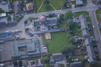 Oblique aerial view of St Thomas' Roman Catholic Church and Presbytery, looking S.