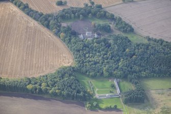 Oblique aerial view of Letterfourie House, Home Farm and Granary, looking SSW.