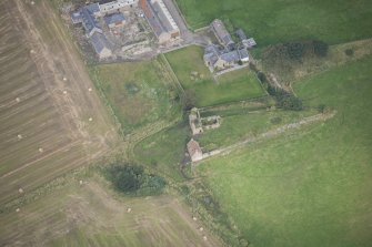 Oblique aerial view of Findochty Castle, looking N.