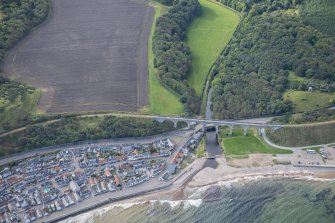 Oblique aerial view of Cullen Burn Viaduct, Road Bridge and Footbridge, looking S.