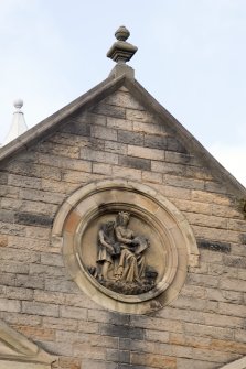 Detail of carved plaque on East elevation.
