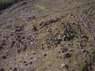 Post-excavation aerial photograph of the dun by Ed Martin, looking south west over the north side of the dun and Trench 2; image shows the exposed outer wall face in Trench 2 and the poorly defined outer wall face in the north east quadrant, Comar Wood Dun, Cannich, Strathglass