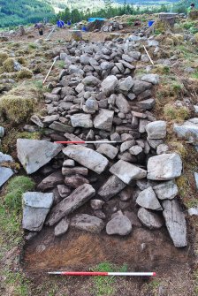 Looking over Trench 2 after initial clean-back - showing the outer face just visible below the rubble spread on the outside of the dun, Comar Wood Dun, Cannich, Strathglass