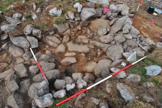Mid-excavation photo showing location of possible intramural cell in the dun outer wall, Trench 2, Comar Wood Dun, Cannich, Strathglass