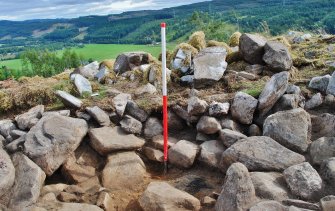 North west facing trench section - showing rubble and soil in section over the dun structure, Comar Wood Dun, Cannich, Strathglass