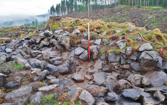 Mid-excavation photo of the east-south-east facing trench section, Comar Wood Dun, Cannich, Strathglass