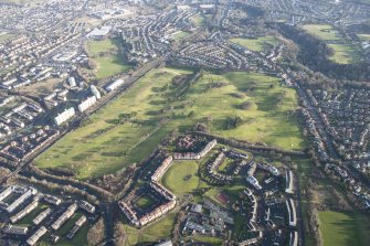 Oblique aerial view of the Kingsknowe golf course and Wester Hailes Primary School, Edinburgh, looking ENE.