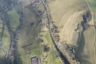 Oblique aerial view of the location of Stobs Camp railway siding and route of the Waverley Railway Line, looking SSW.