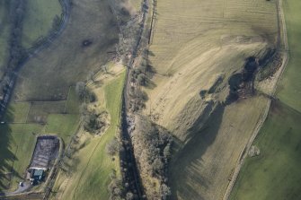 Oblique aerial view of the location of Stobs Camp railway siding and route of the Waverley Railway Line, looking S.