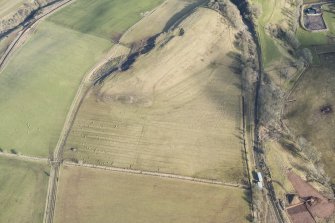 Oblique aerial view of the route of the Waverley Railway Line and Stobs Camp sidings, looking NNE.