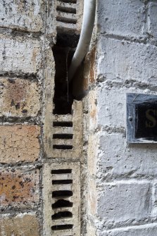 Detail of external ventilation bricks in underground buildings.