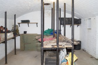 General view of underground shell room showing metal supports.