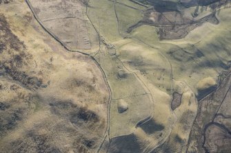 Oblique aerial view of the farmstead at Bad an Loin and the Grave of Diarmid four poster stone circle in Glen Shee, looking ESE.