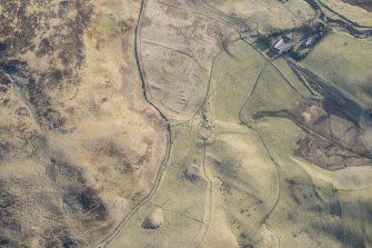 Oblique aerial view of the depopulated township at Tomb and the Grave of Diarmid four poster stone circle in Glen Shee, looking ENE.