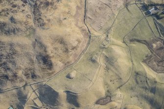 Oblique aerial view of the depopulated township at Tomb and the Grave of Diarmid four poster stone circle in Glen Shee, looking ENE.