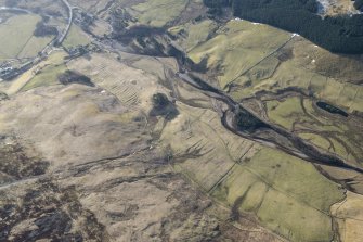 Oblique aerial view of the farmsteads and rig on the NE bank of the Shee Water, Glen Shee, looking S.