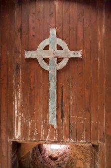 General view of wooden cross underneath the bellcote.