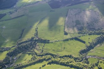 Oblique aerial view of the Coupar Angus to Fort George military road to the north of Bridge of Cally, looking W.
