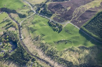 Oblique aerial view of a farmstead, enclosures and rig and furrow at Lair in Glen Shee, looking SW.