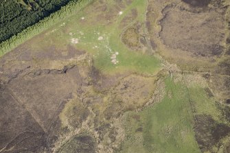 Oblique aerial view of a Pitcarmick building and rig at Lair in Glen Shee, looking SE.