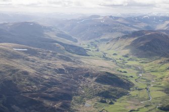 General oblique aerial view of Glen Shee with Spittal of Glenshee and Dalmunzie House in the distance, looking NW.