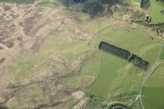 Oblique aerial view of the townships, field system and rig at Gleann Fearnach on the slopes of Creag Dubh Leitir, looking E.