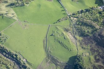 Oblique aerial view of the farmstead and rig at Clach Mhor, Straloch, in Strathardle, looking SSW.