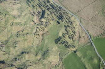 Oblique aerial view of the farmstead, head dyke and rig at Ceanghline in Glen Brerachan, looking SE.