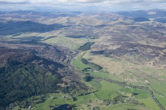 General oblique aerial view of Gleann Fearnach with Glenfernate Lodge and Loch Crannach beyond, looking NNE.