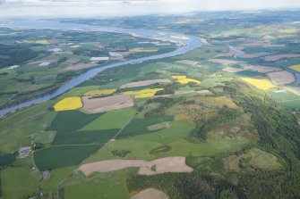 General oblique aerial view of Moncreiffe Hill, the confluence of the rivers Earn and Tay and the Firth of Tay beyond, looking E.