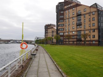 General view of riverside walkway, looking east.