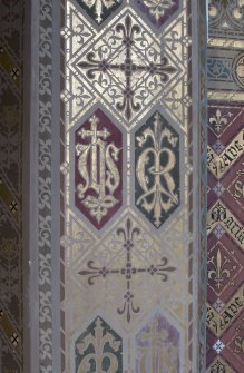 Painted decoration on chancel arch.