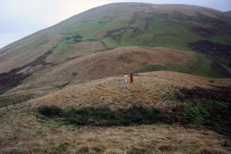 View of the Roman watch tower with the road visible at the lowest point of the pass, looking north.