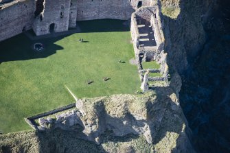 Oblique aerial view of the west wing of Tantallon Castle, looking WSW.