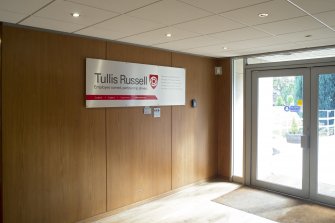 Interior. View of Administration office building, ground floor, reception area entrance with company sign