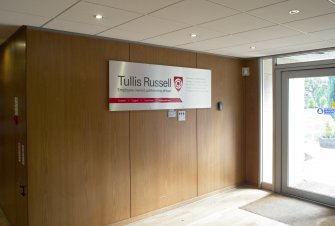 Interior. View of Administration office building, ground floor, reception area with company sign