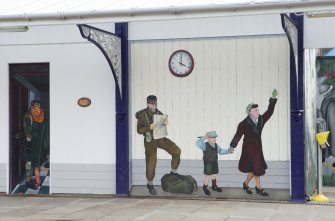 Detail of murals and station clock to east of entrance