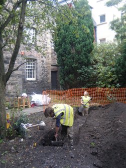 Report illustration 3, caption 'working shot' -  of the excavation of trench 1, from an archaeological excavation at Acheson House, Canongate, Edinburgh